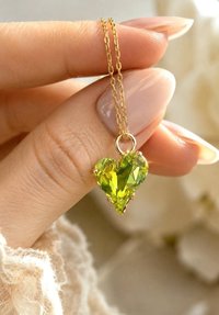 Citrus green crystal Sweet Heart pendant necklace on a delicate gold cable chain.