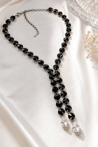 Gothic Glamour inspired Swarovski black Rivoli jewelry with a dramatic double drop design and sparkling clear pear stones.
