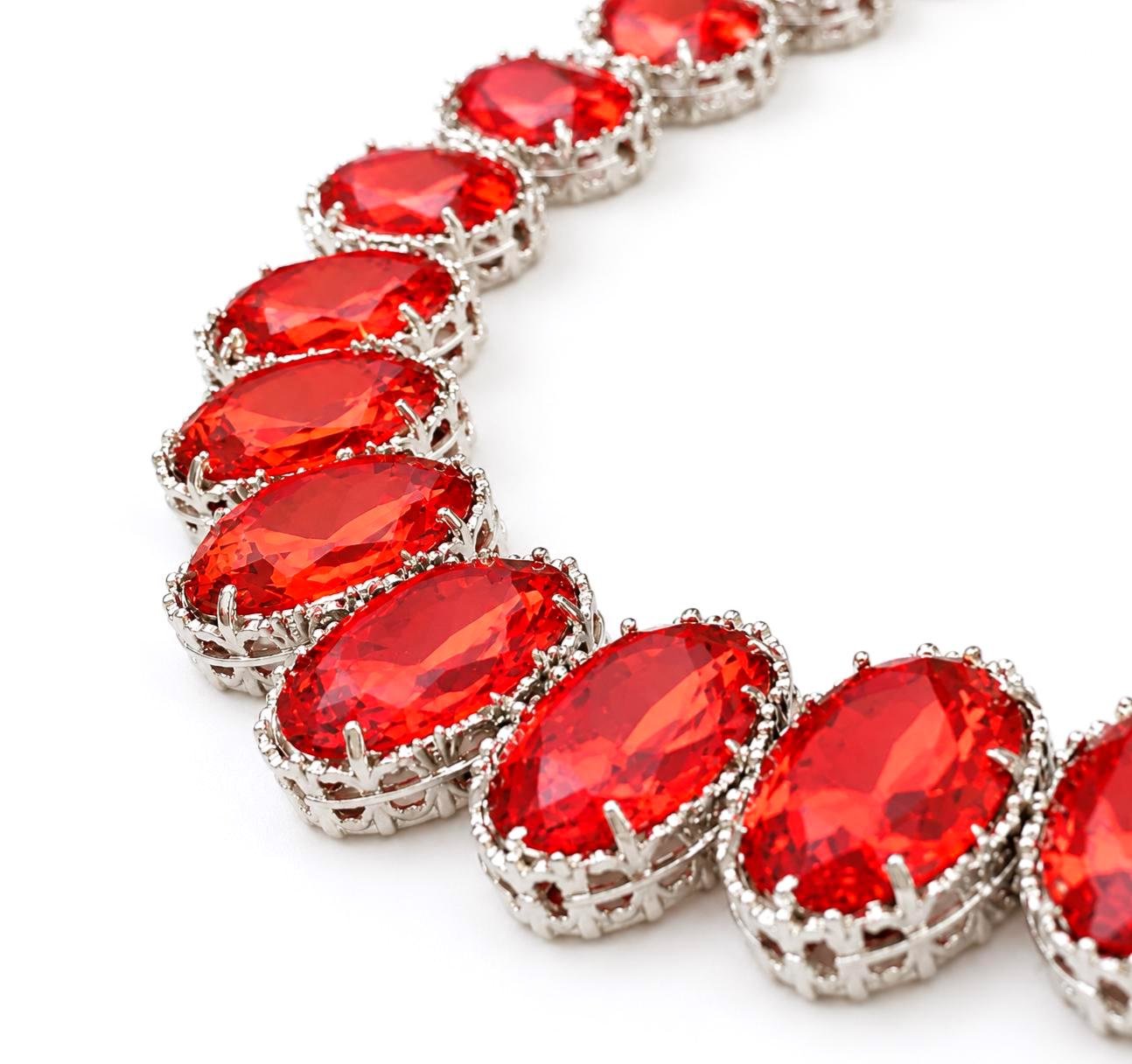 Platinum filigree Collier Necklace with bright hyacinth red oval crystals styled as glamorous evening jewelry with bold vintage aesthetic
