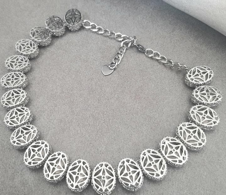 Platinum Filligree Necklace with hyacinth crystals, photo shows the back of the oval filigree prong setting of the necklace