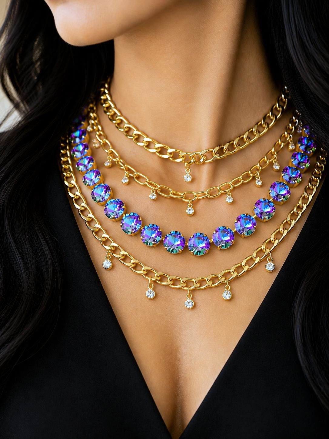 Gold layered chain necklace with iridescent crystal choker and small crystal pendants close up