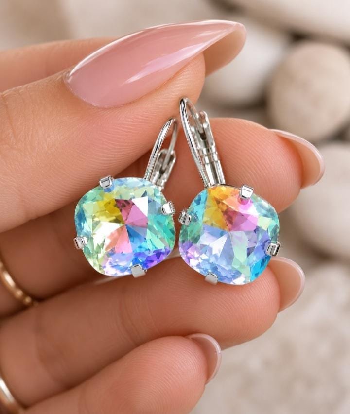 Silver plated leverback drop earrings with 12mm Swarovski rainbow cushion cut crystals.