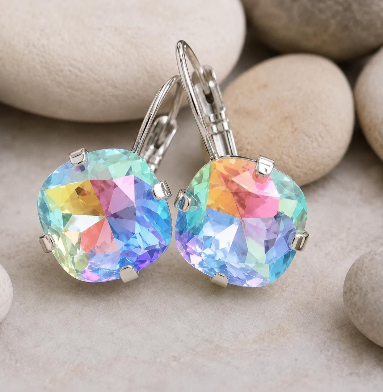 Handmade silver drop earrings featuring vibrant 12mm rainbow Swarovski cushion crystals.