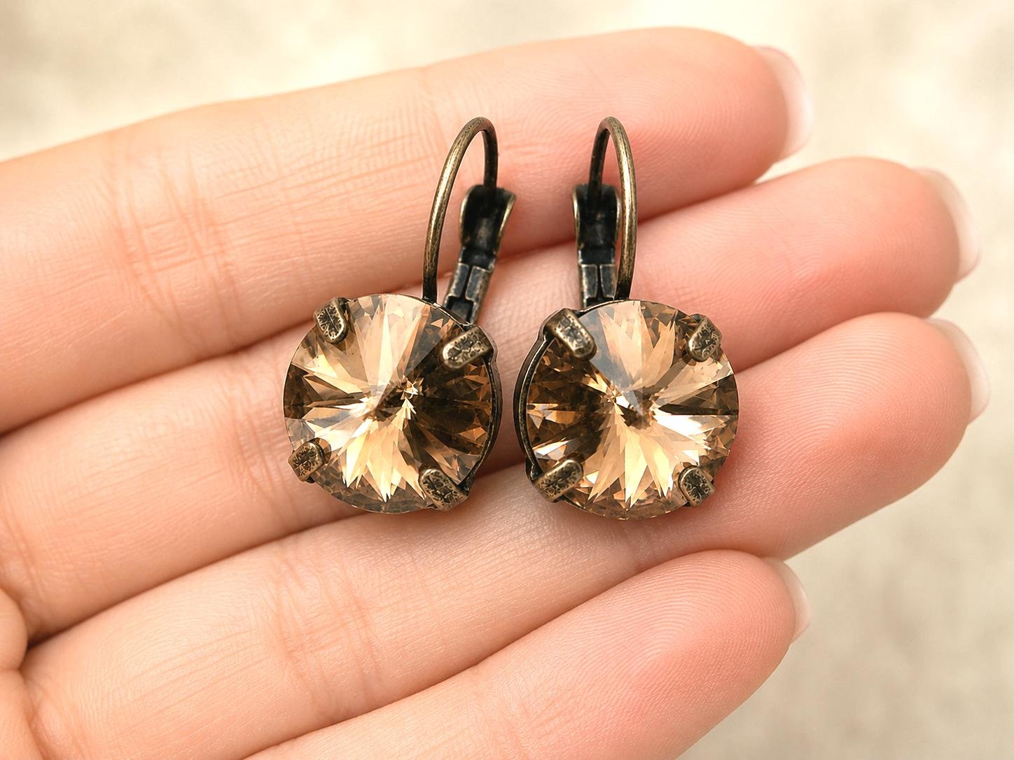 Round Swarovski crystal drop earrings in warm copper on antique bronze leverback findings.