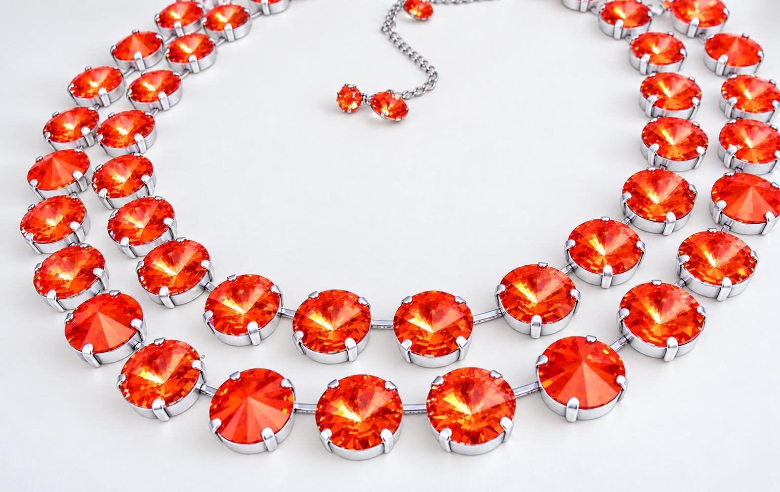 Double strand necklace with 12mm Orange Ignite Swarovski Rivoli crystals in silver plated cupchain setting