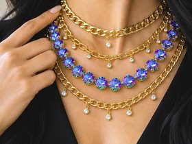 Layered gold chains necklace with Light Vitrail Austrian rivoli crystals on model wearing black V neck top